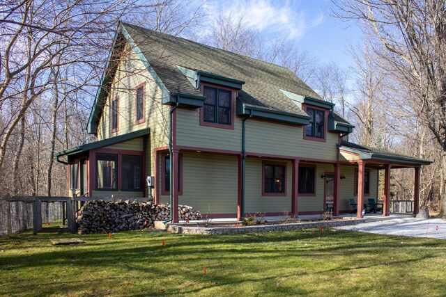 16434 S Basswood Rd, Three Oaks, MI 49128 - view of front of property featuring covered porch, a front yard, and roof with shingles