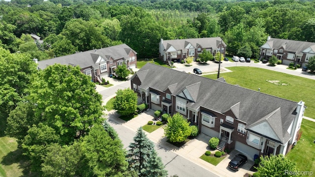71 Grandview Cir, White Lake, MI 48386 - aerial view of residential area with a heavily wooded area