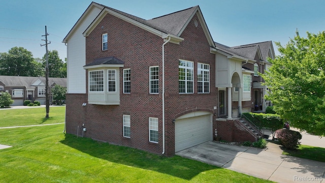 71 Grandview Cir, White Lake, MI 48386 - view of home's exterior with brick siding, an attached garage, a yard, and concrete driveway