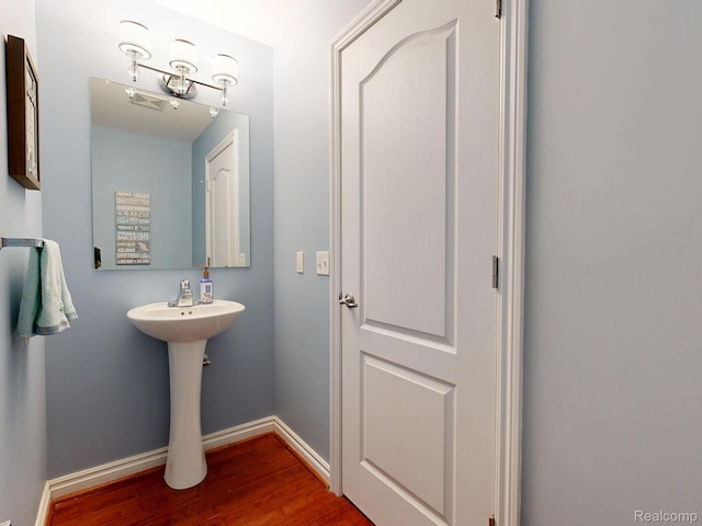 71 Grandview Cir, White Lake, MI 48386 - bathroom with wood finished floors and baseboards