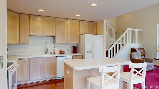 71 Grandview Cir, White Lake, MI 48386 - kitchen with white appliances, a sink, light brown cabinets, recessed lighting, and light countertops