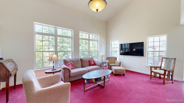 71 Grandview Cir, White Lake, MI 48386 - carpeted living area featuring baseboards and high vaulted ceiling