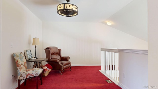 71 Grandview Cir, White Lake, MI 48386 - sitting room with carpet floors, lofted ceiling, and baseboards