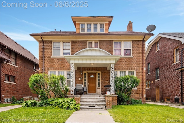 1475 Atkinson St, Detroit, MI 48206 - view of front facade featuring a chimney, brick siding, and a front yard