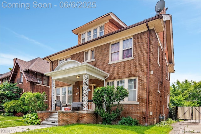 1475 Atkinson St, Detroit, MI 48206 - view of front of property featuring covered porch, brick siding, and a gate