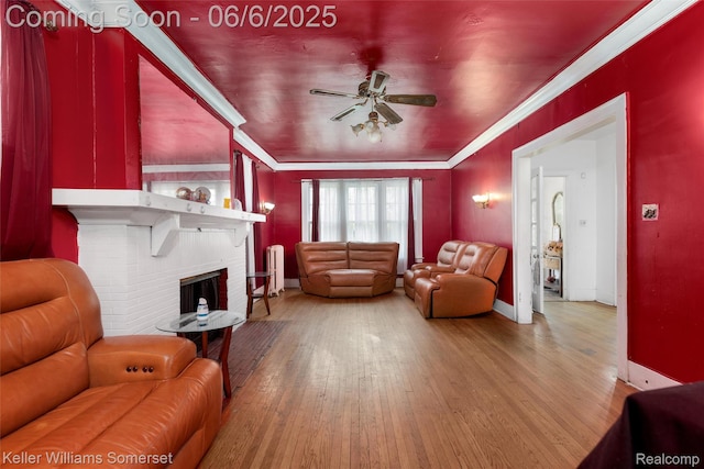 1475 Atkinson St, Detroit, MI 48206 - living room with ceiling fan, wood finished floors, crown molding, a fireplace, and baseboards