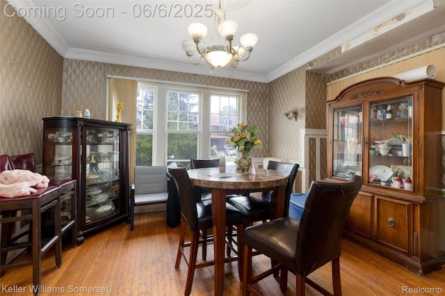 1475 Atkinson St, Detroit, MI 48206 - dining room featuring wallpapered walls, light wood-style flooring, a chandelier, and crown molding