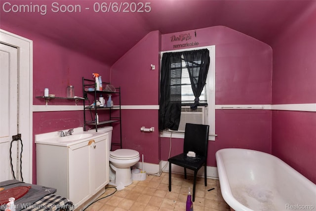 1475 Atkinson St, Detroit, MI 48206 - bathroom with a soaking tub, vaulted ceiling, vanity, toilet, and tile patterned floors