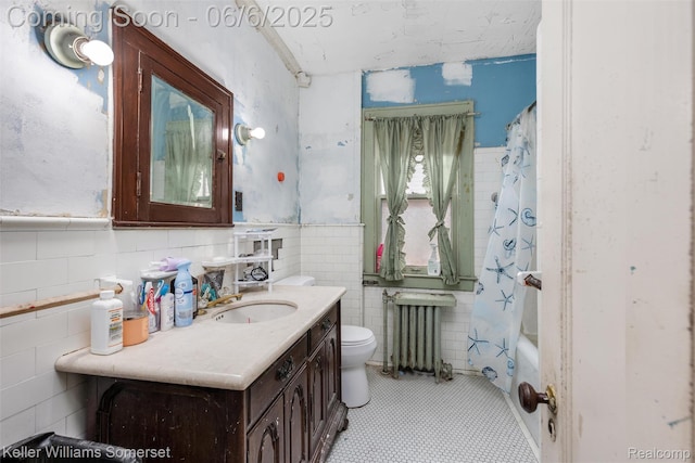 1475 Atkinson St, Detroit, MI 48206 - full bathroom featuring radiator heating unit, tile walls, vanity, toilet, and wainscoting