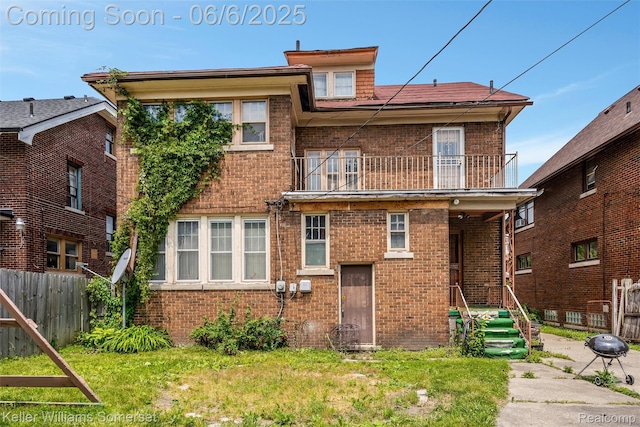 1475 Atkinson St, Detroit, MI 48206 - back of house with brick siding and a balcony