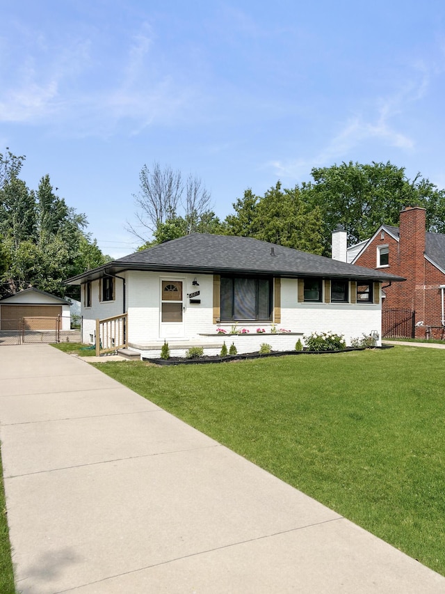 20215 Damman St, Harper Woods, MI 48225 - view of front of house with an outbuilding, a garage, a chimney, brick siding, and roof with shingles