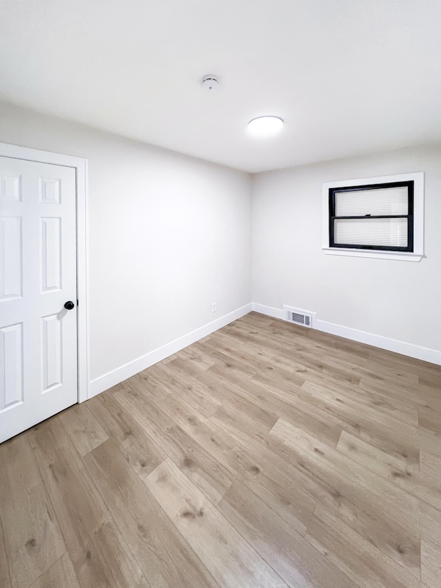 20215 Damman St, Harper Woods, MI 48225 - spare room featuring light wood finished floors, a smoke detector, and baseboards
