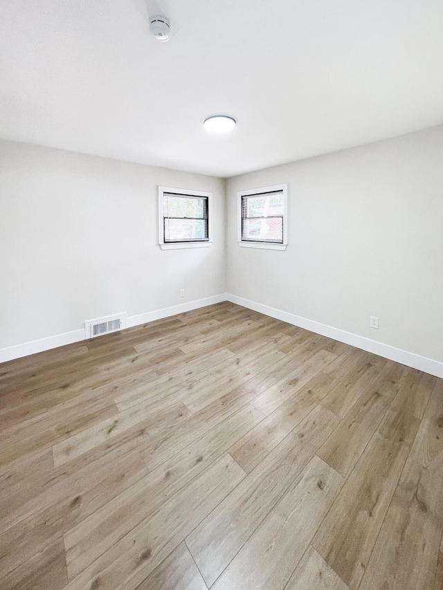 20215 Damman St, Harper Woods, MI 48225 - spare room with wood finished floors, a smoke detector, and baseboards