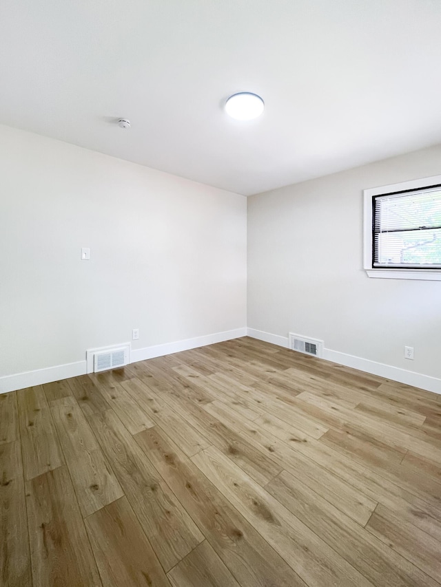 20215 Damman St, Harper Woods, MI 48225 - spare room featuring light wood-style flooring and baseboards