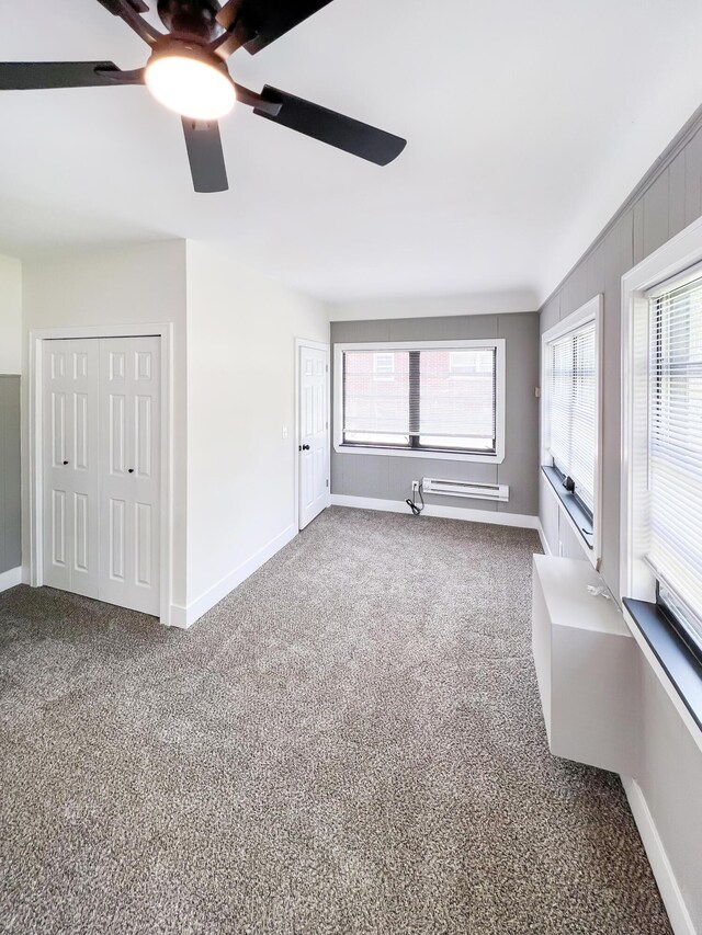20215 Damman St, Harper Woods, MI 48225 - unfurnished living room featuring ceiling fan, baseboards, and carpet