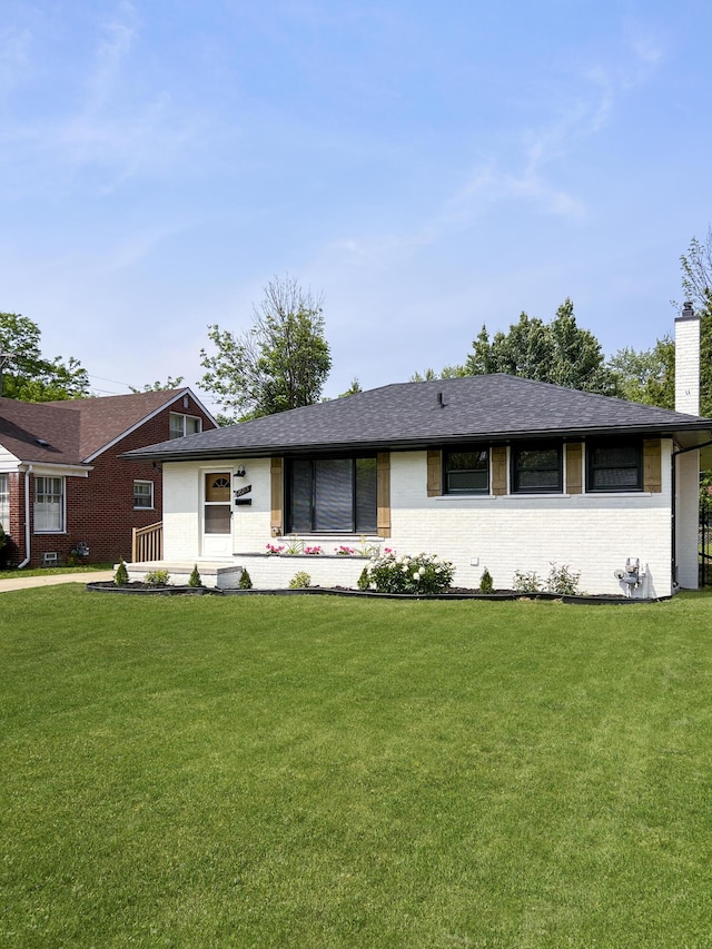 20215 Damman St, Harper Woods, MI 48225 - single story home with a chimney, brick siding, and a front yard