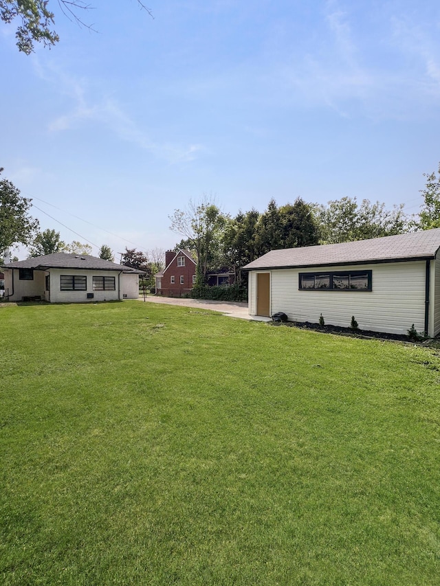 20215 Damman St, Harper Woods, MI 48225 - view of green lawn featuring concrete driveway and an attached garage