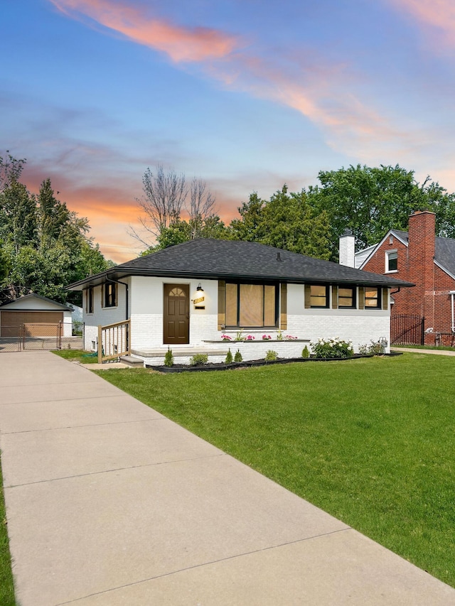 20215 Damman St, Harper Woods, MI 48225 - view of front facade with an outbuilding, a chimney, a garage, brick siding, and a shingled roof