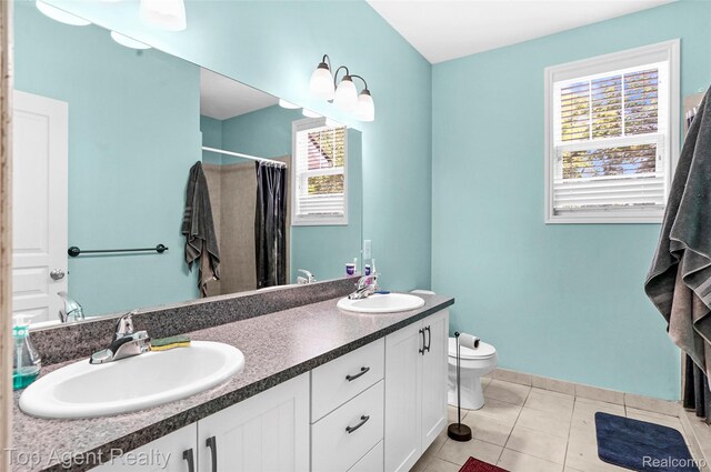 11685 Squiers Blvd, Utica, MI 48315 - full bathroom with double vanity, tile patterned floors, and a shower with shower curtain