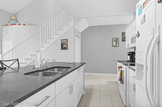 11685 Squiers Blvd, Utica, MI 48315 - kitchen featuring white appliances, white cabinets, and light tile patterned floors