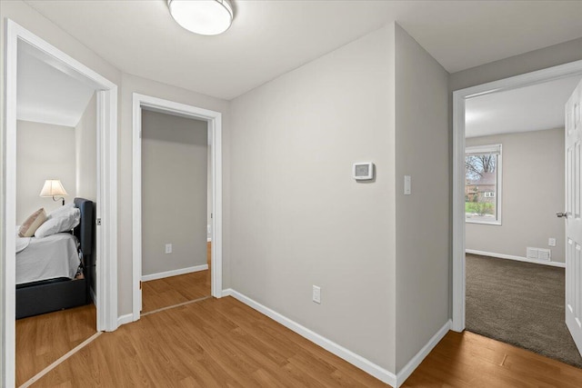 2128 Somerset Rd, Bloomfield Hills, MI 48302 - hall with light wood-style flooring and baseboards