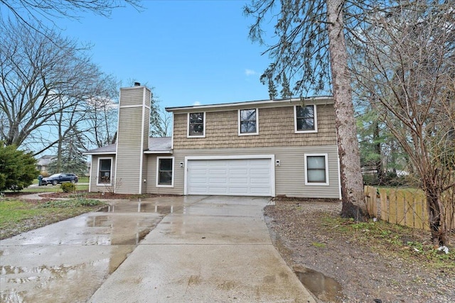 2128 Somerset Rd, Bloomfield Hills, MI 48302 - view of front of house featuring concrete driveway, a chimney, and an attached garage