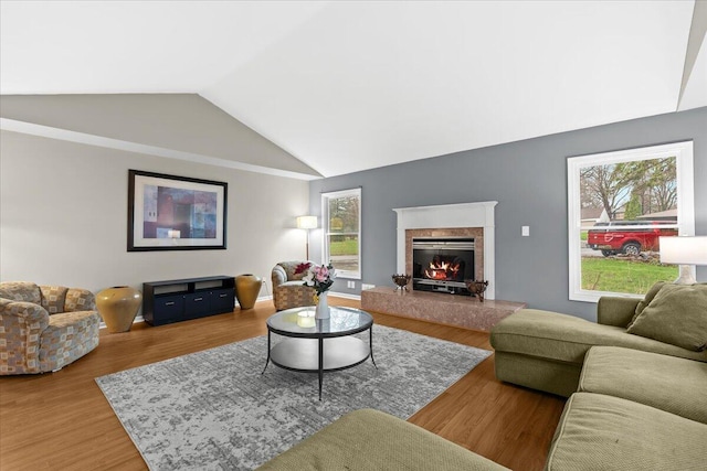 2128 Somerset Rd, Bloomfield Hills, MI 48302 - living room featuring lofted ceiling, wood finished floors, a high end fireplace, and plenty of natural light