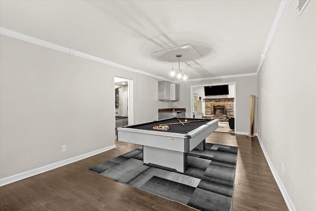 2128 Somerset Rd, Bloomfield Hills, MI 48302 - playroom featuring ornamental molding, billiards table, dark wood-style flooring, baseboards, and a stone fireplace