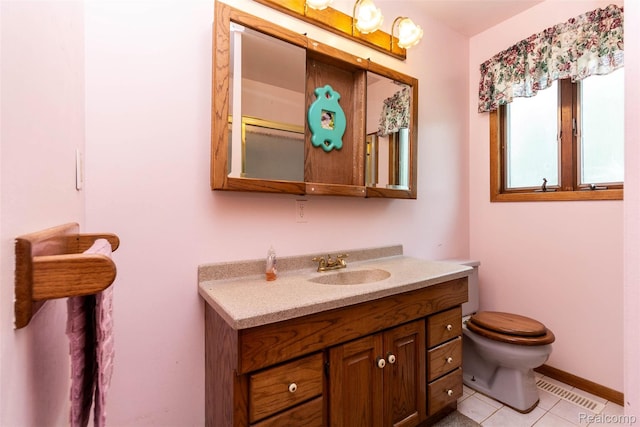 2650 Devonshire, Leonard, MI 48367 - bathroom featuring vanity, toilet, tile patterned flooring, and baseboards