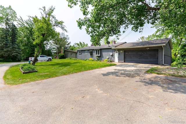 2650 Devonshire, Leonard, MI 48367 - ranch-style home featuring driveway, a garage, and a front yard