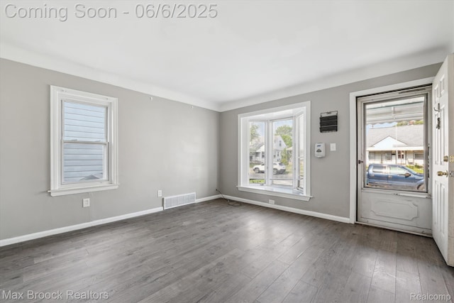 21426 Syracuse Ave, Warren, MI 48091 - foyer with baseboards and dark wood-style floors