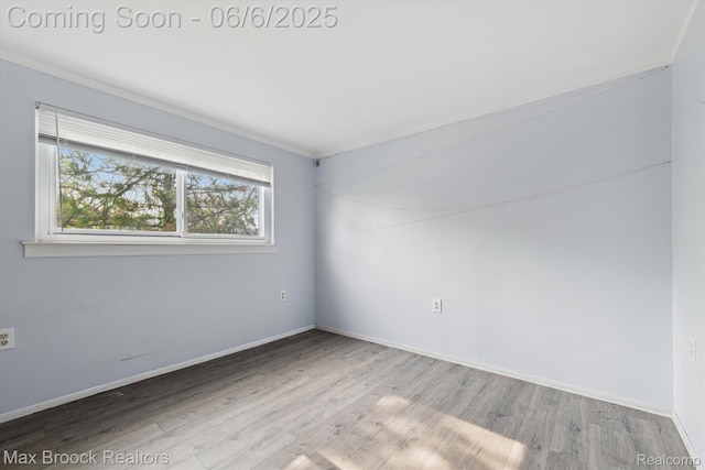 21426 Syracuse Ave, Warren, MI 48091 - spare room with wood finished floors, baseboards, and ornamental molding