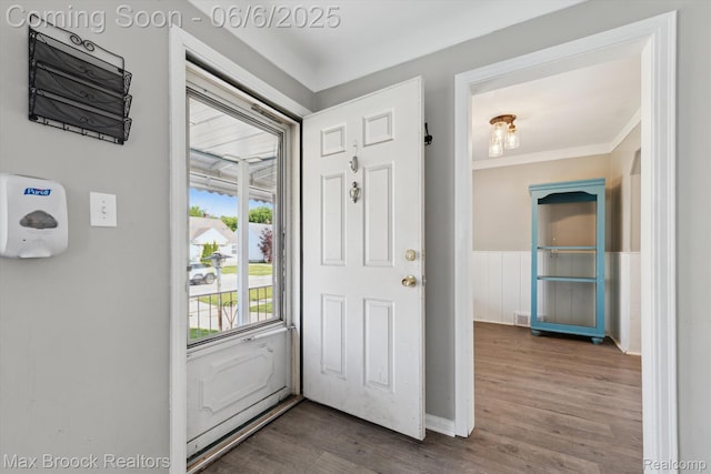 21426 Syracuse Ave, Warren, MI 48091 - foyer entrance featuring wood finished floors, wainscoting, and crown molding