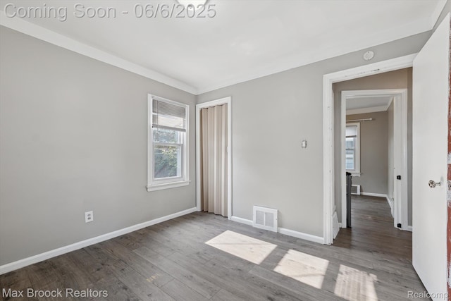 21426 Syracuse Ave, Warren, MI 48091 - empty room with wood finished floors and baseboards