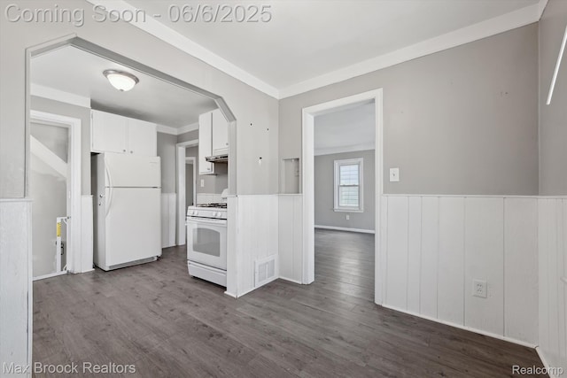 21426 Syracuse Ave, Warren, MI 48091 - kitchen featuring white appliances, wainscoting, white cabinets, dark wood finished floors, and under cabinet range hood