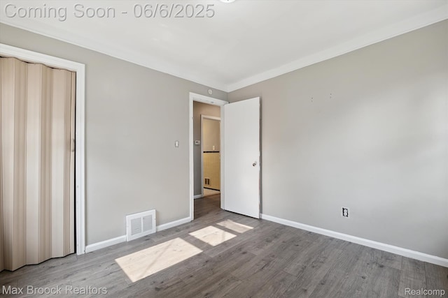 21426 Syracuse Ave, Warren, MI 48091 - unfurnished bedroom featuring wood finished floors and baseboards