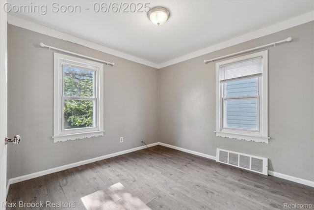 21426 Syracuse Ave, Warren, MI 48091 - unfurnished room featuring wood finished floors, baseboards, and crown molding