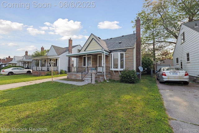 21426 Syracuse Ave, Warren, MI 48091 - view of front of property featuring covered porch and a front lawn