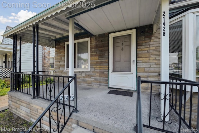 21426 Syracuse Ave, Warren, MI 48091 - entrance to property featuring a porch and stone siding
