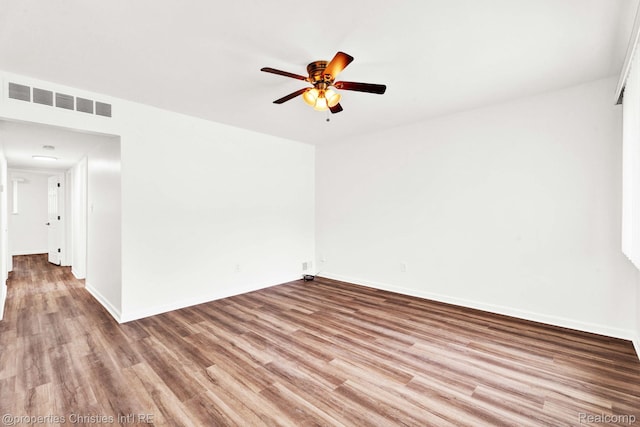 244 E Woodward Heights Blvd, Hazel Park, MI 48030 - spare room with a ceiling fan, wood finished floors, and baseboards