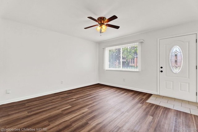 244 E Woodward Heights Blvd, Hazel Park, MI 48030 - foyer entrance with dark wood-style flooring, ceiling fan, and baseboards