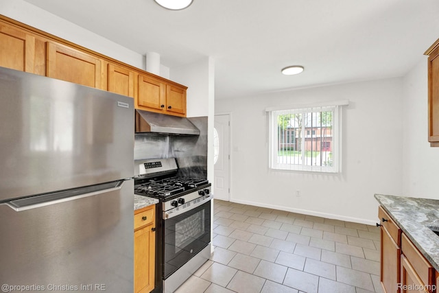244 E Woodward Heights Blvd, Hazel Park, MI 48030 - kitchen featuring stainless steel appliances, under cabinet range hood, baseboards, light stone countertops, and light tile patterned floors