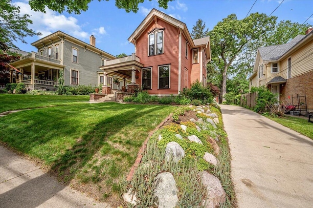 244 Paris Ave SE, Grand Rapids, MI 49503 - view of front of property featuring a front yard and concrete driveway