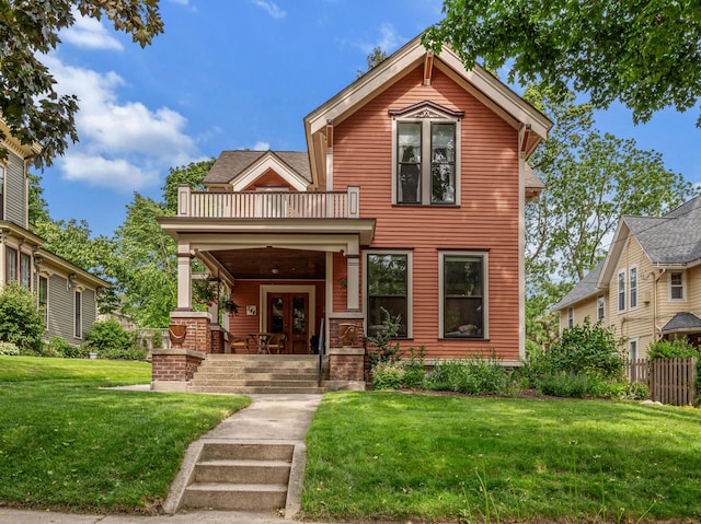 244 Paris Ave SE, Grand Rapids, MI 49503 - view of front of home with a balcony, a front lawn, covered porch, and french doors