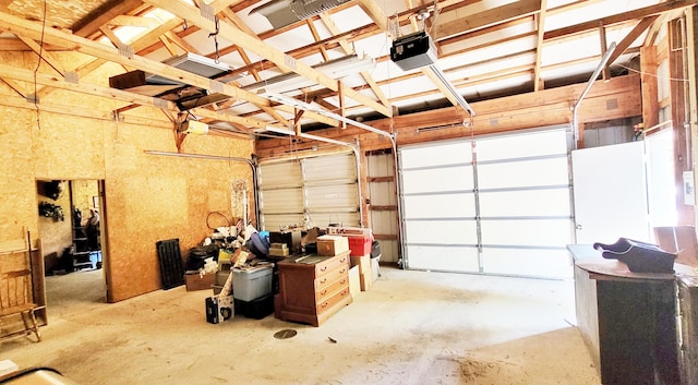 5350 E Crystal Lake Rd, Holton, MI 49425 - garage with a garage door opener