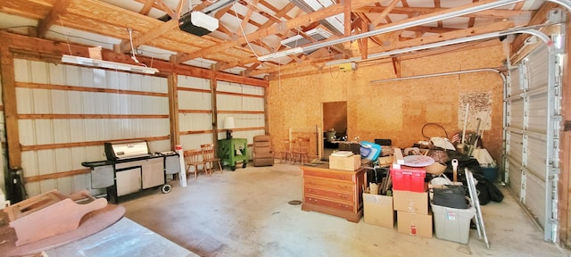 5350 E Crystal Lake Rd, Holton, MI 49425 - garage featuring a garage door opener