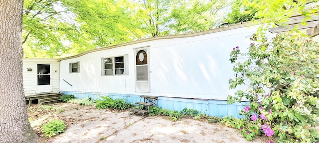 5350 E Crystal Lake Rd, Holton, MI 49425 - view of property exterior featuring entry steps
