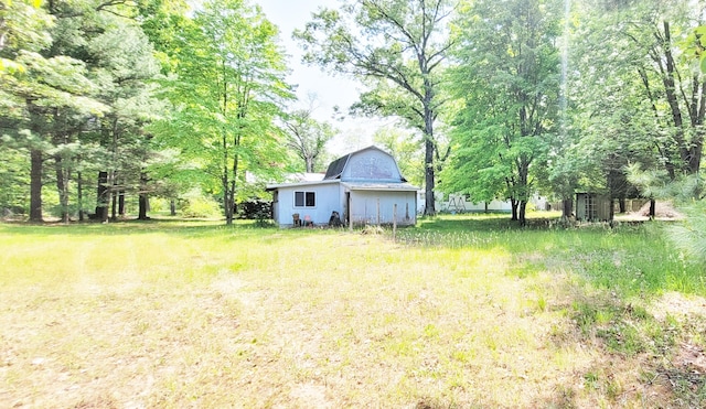5350 E Crystal Lake Rd, Holton, MI 49425 - view of yard featuring a barn and an outdoor structure