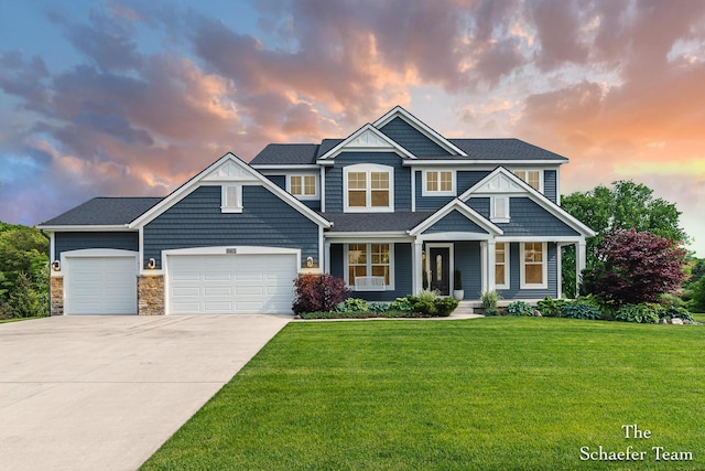 12150 Apple Cart Ln, Lowell, MI 49331 - view of front facade featuring an attached garage, driveway, a front yard, covered porch, and stone siding