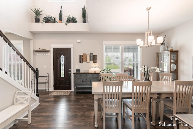 12150 Apple Cart Ln, Lowell, MI 49331 - dining space with a chandelier, dark wood-type flooring, and stairs